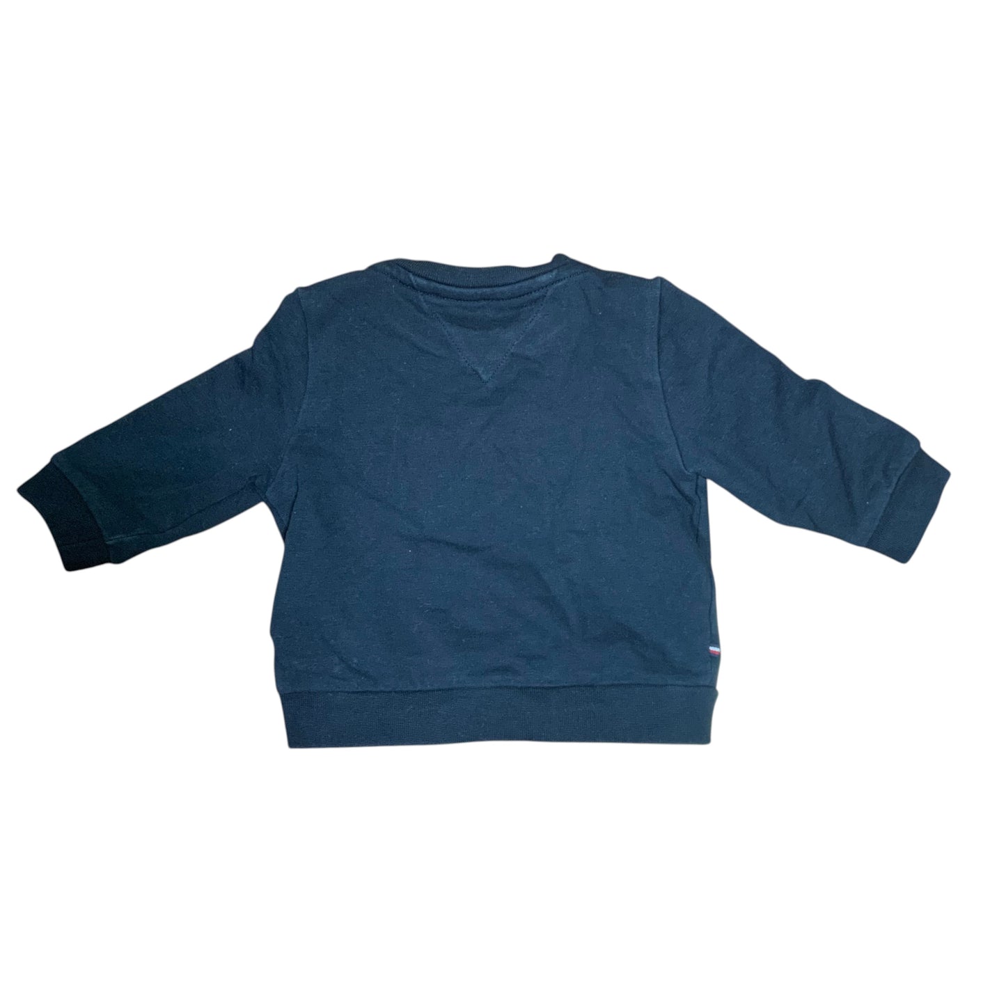 Back view of a black Amare Tutto Tommy tracksuit sweatshirt with ribbed cuffs and hem on a wooden floor.