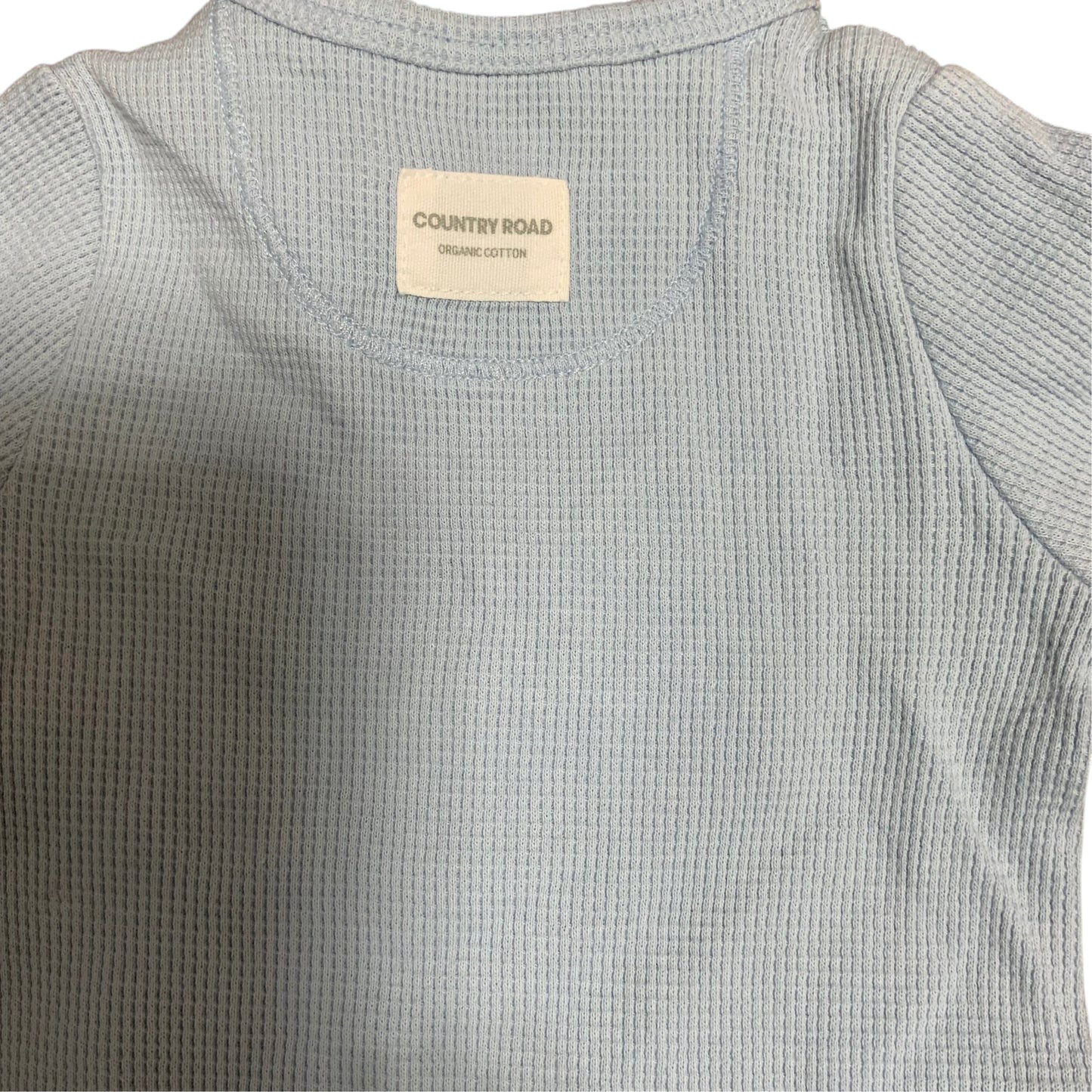Amare Tutto Country Road baby one piece in light blue waffle knit organic cotton with interior brand label