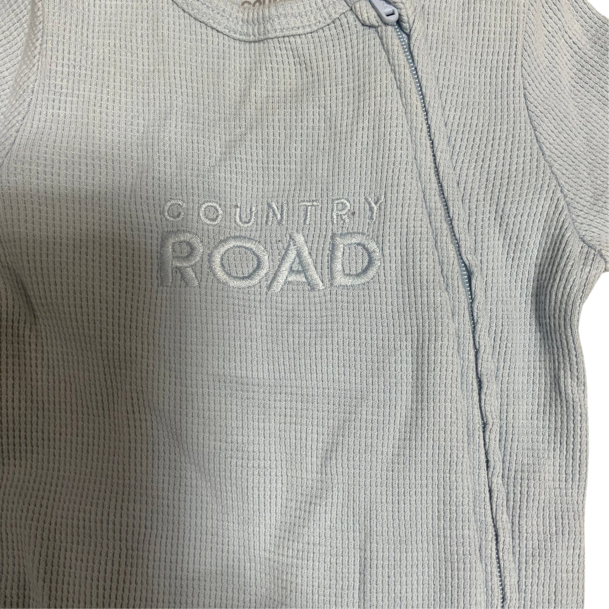 Amare Tutto light blue waffle knit Country Road baby one piece with a side zipper closure
