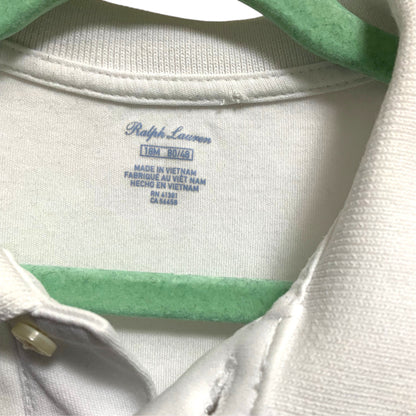 Amare Tutto pre-owned white Ralph Lauren baby polo shirt size 18M label detail on a green hanger