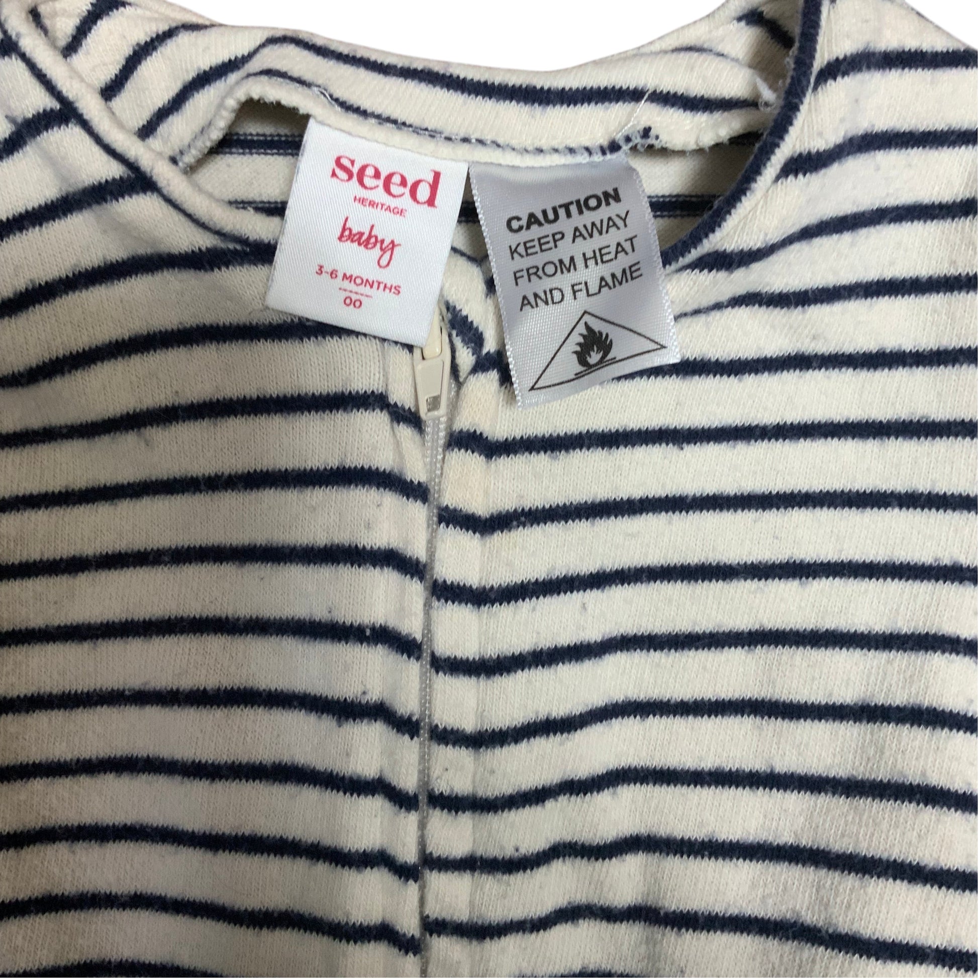 Amare Tutto Seed baby one piece in cream with navy blue horizontal stripes and front zipper closure