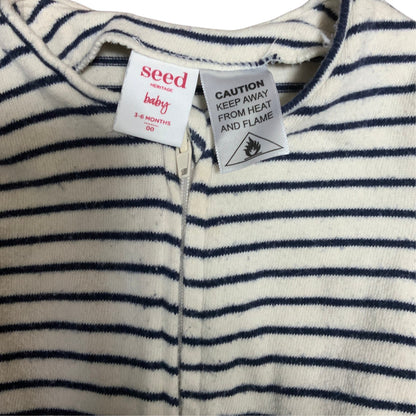Amare Tutto Seed baby one piece in cream with navy blue horizontal stripes and front zipper closure