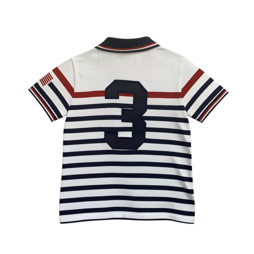 Amare Tutto toddler polo shirt in white with navy and red stripes, featuring a large number 3 and USA flag detail.