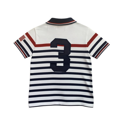 Amare Tutto toddler polo shirt in white with navy and red stripes, featuring a large number 3 and USA flag detail.