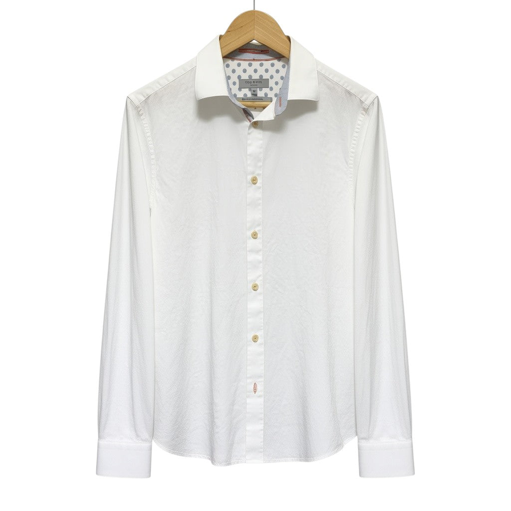 Amare Tutto Ted Baker London white cotton shirt with embossed leaf texture, contrast orange stitching, and collar trim.